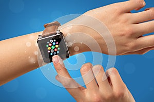 Female hand with smartwatch and app icons