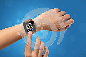 Female hand with smartwatch and app icons