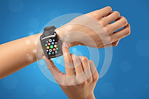 Female hand with smartwatch and app icons