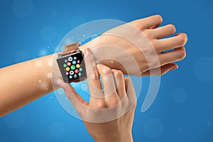 Female hand with smartwatch and app icons