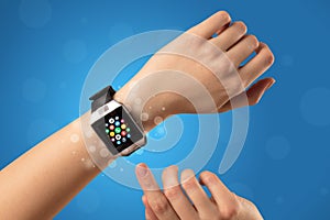 Female hand with smartwatch and app icons