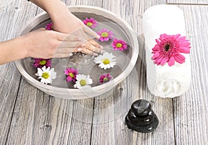 Female hand at spa salon on pedicure procedure