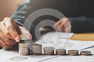 female hand stack coins to show for business accounting