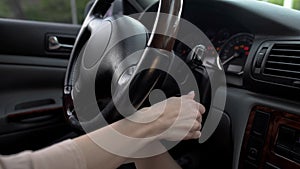 Female hand starting car engine, business woman driving luxury vehicle, close up