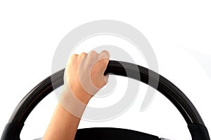 Female hand on a steering wheel