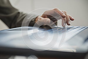 Female hand typing on laptop computer keyboard