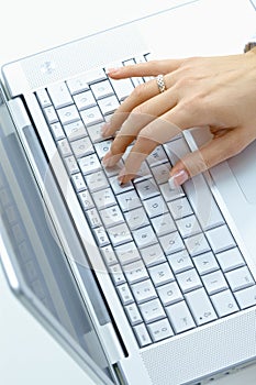 Female hand using laptop