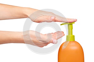 Female hand using liquid soap isolated on white background