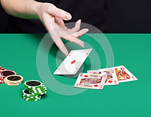 Female hand with a winning card combinations