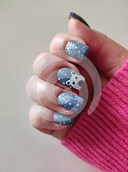 Female hand with winter acrylic manicure