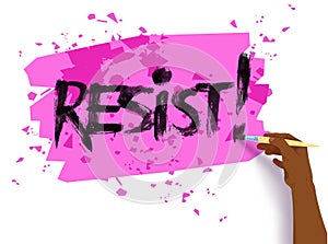 Female hand writing Resist slogan