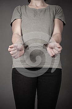 Female in handcuffs closeup,arrest for breaking the law