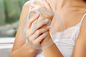 Female Hands Applying Cream, Lotion. Beautiful Woman Hands. Soft skin, skincare concept. Hand Skin Care.