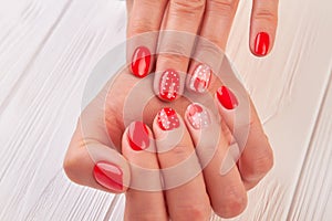 Female hands with beautiful designed manicure.