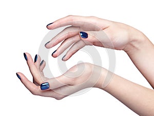 Female hands with blue shiny nails manicure