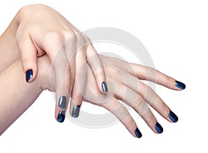 Female hands with blue shiny nails manicure