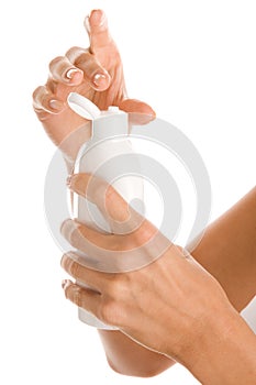 Female hands with body lotion