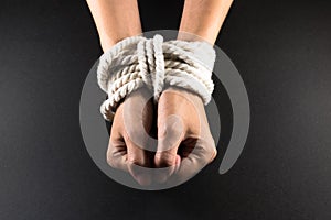 Female Hands Bound in Bondage with Rope