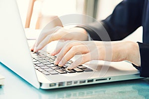 Female hands of business woman typing on computer keyboard