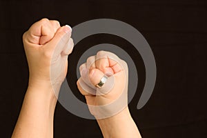 Female Hands Clenched into Fists ready for a fight photo