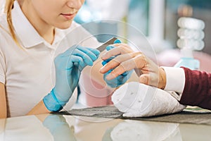 Female hands clipping nails