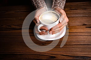 Female hands and coffee