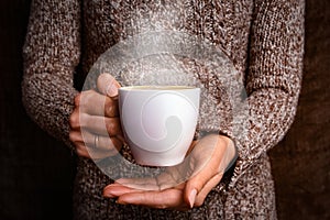 Female hands and coffee