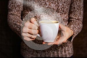 Female hands and coffee
