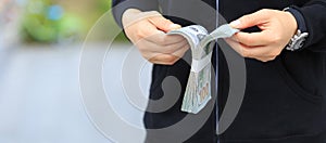 Female hands counting money