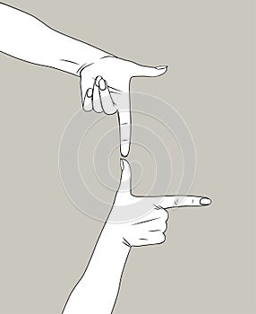 Female hands depict a frame of thumbs and forefingers photo