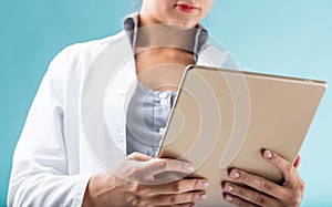 Female hands, digital tablet, flames, white lab coat, modern wor