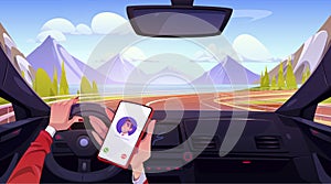 Female hands driving car and holding smartphone