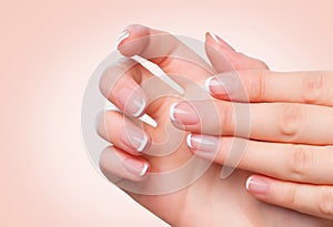 Female hands with french manicure. Spa and skincare