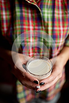 Female hands with glasse of vegan milk, Alternative types of non-dairy milks