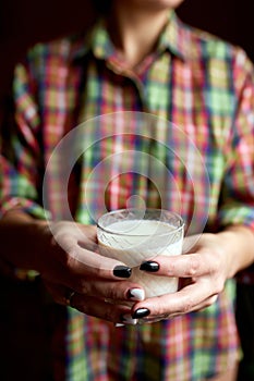 Female hands with glasse of vegan milk, Alternative types of non-dairy milks