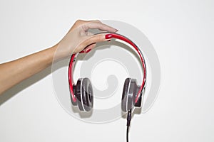 Female hands hold headphones