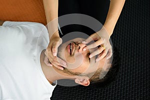 Female hands hold nose and open mouth CPR