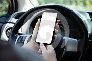 female hands hold phone with isolated screen background in car