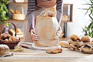 Female hands holding bread packet