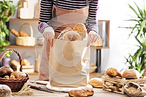 Female hands holding bread packet