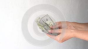 Female hands holding and counting cash money dollars. Business and finance concept. Horizontal 4k footage