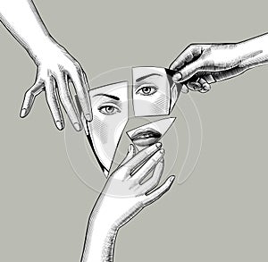 Female hands holding in fingers fragments of a broken mirror with a reflection of a female face