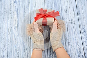 female hands holding a gift