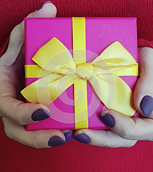 Female hands holding a gift box present decoration anniversary celebration