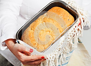 Female hands holding handmade bread