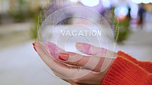 Female hands holding hologram with text Vacation