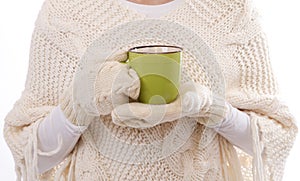 Female hands holding hot mug close up