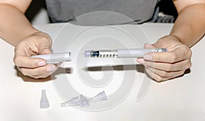 Female hands holding an insulin pen. Ozempic Insulin injection pen.