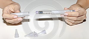 Female hands holding an insulin pen. Ozempic Insulin injection pen.