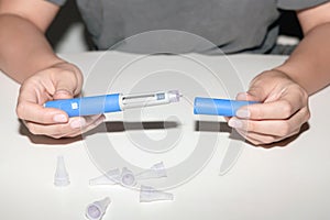 Female hands holding an insulin pen. Ozempic Insulin injection pen. photo
